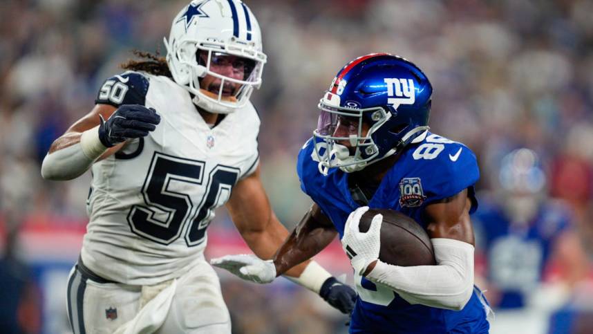 Sep 26, 2024; East Rutherford, NJ, US; New York Giants wide receiver Darius Slayton (86) runs with the ball after a catch while being chased by Dallas Cowboys linebacker Eric Kendricks (50) at MetLife Stadium. Mandatory Credit: Julian Guadalupe-NorthJersey.com