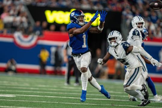 Sep 26, 2024; East Rutherford, NJ, US; New York Giants wide receiver Malik Nabers (1) catches a pass in the fourth quarter before being tackled by Dallas Cowboys cornerback Jourdan Lewis (2) at MetLife Stadium. Mandatory Credit: Julian Guadalupe-NorthJersey.com