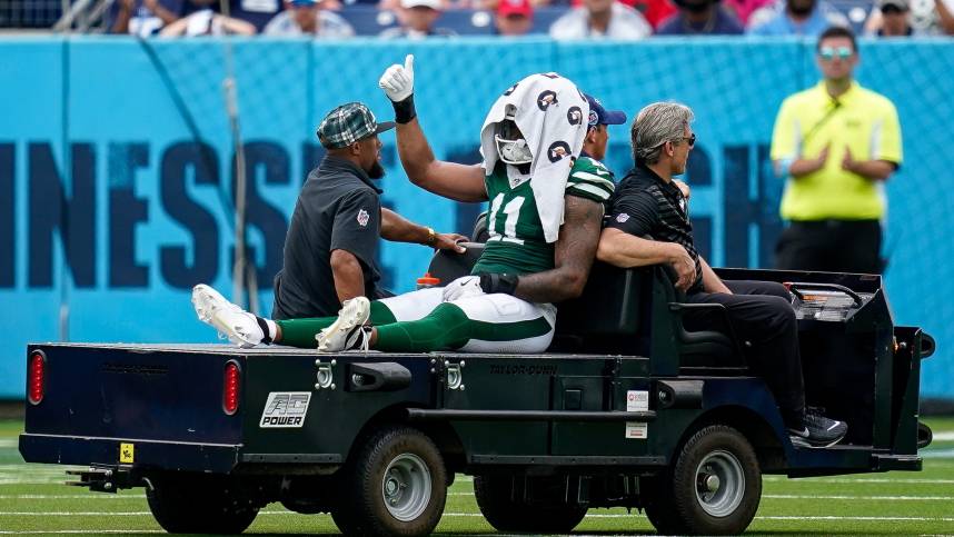 New York Jets linebacker Jermaine Johnson (11) exits the field after an injury during the third quarter against the Tennessee Titans at Nissan Stadium in Nashville, Tenn., Sunday, Sept. 15, 2024.