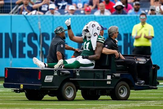 New York Jets linebacker Jermaine Johnson (11) exits the field after an injury during the third quarter against the Tennessee Titans at Nissan Stadium in Nashville, Tenn., Sunday, Sept. 15, 2024.