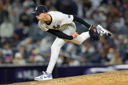 Oct 14, 2024; Bronx, New York, USA; New York Yankees pitcher Luke Weaver (30) pitches during the eighth inning against the Cleveland Guardians in game one of the ALCS for the 2024 MLB Playoffs at Yankee Stadium. Mandatory Credit: Brad Penner-Imagn Images