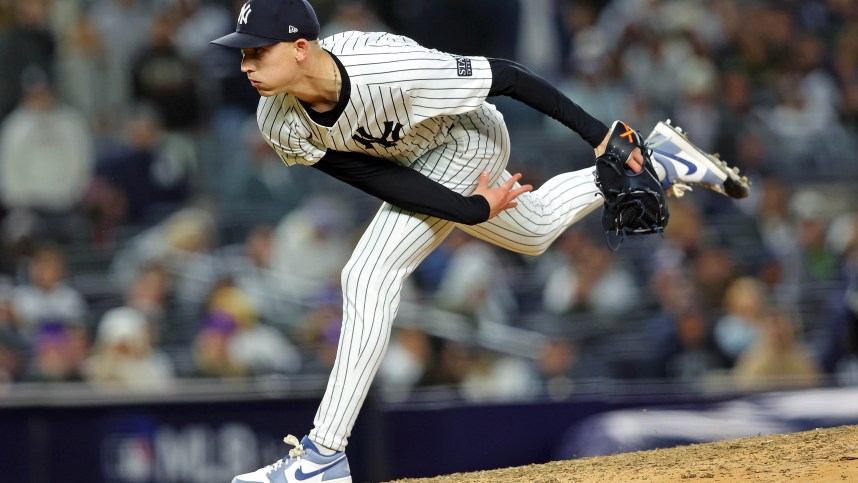 Oct 14, 2024; Bronx, New York, USA; New York Yankees pitcher Luke Weaver (30) pitches during the eighth inning against the Cleveland Guardians in game one of the ALCS for the 2024 MLB Playoffs at Yankee Stadium. Mandatory Credit: Brad Penner-Imagn Images