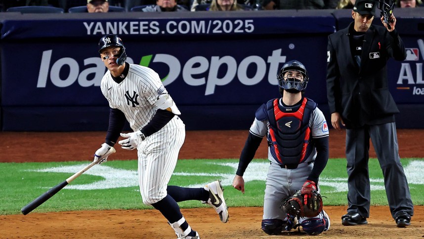 Oct 15, 2024; Bronx, New York, USA; New York Yankees outfielder Aaron Judge (99) hits a two run home run during the seventh inning against the Cleveland Guardians in game two of the ALCS for the 2024 MLB Playoffs at Yankee Stadium. Mandatory Credit: Brad Penner-Imagn Images