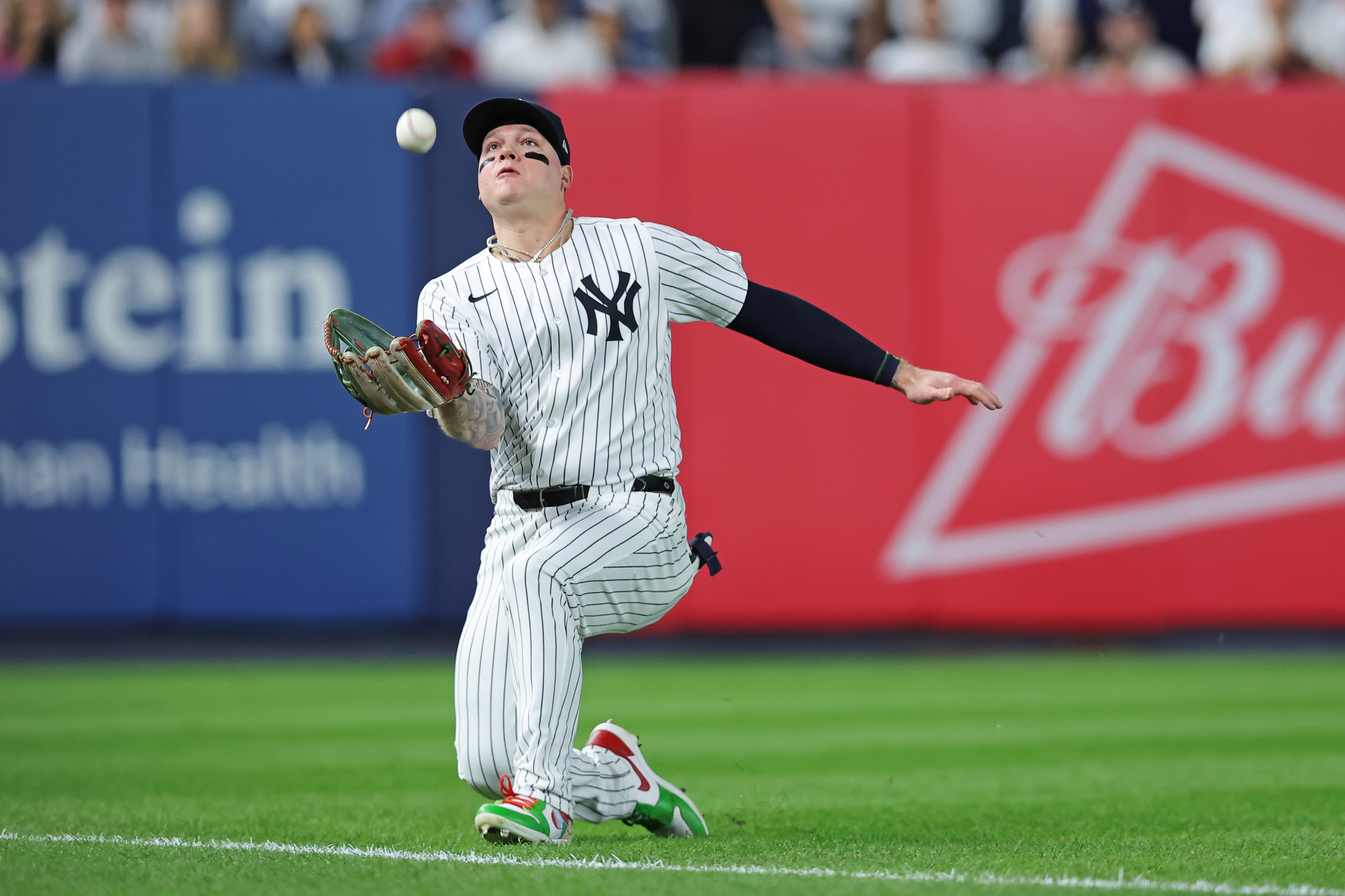 Oct 5, 2024; Bronx, New York, USA; New York Yankees outfielder Alex Verdugo (24) catches a popup during the fourth inning hit by Kansas City Royals pitcher Michael Lorenzen (24) during game one of the ALDS for the 2024 MLB Playoffs at Yankee Stadium. Mandatory Credit: Brad Penner-Imagn Images