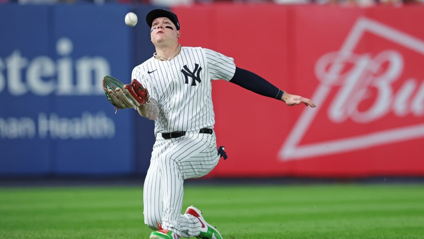 Oct 5, 2024; Bronx, New York, USA; New York Yankees outfielder Alex Verdugo (24) catches a popup during the fourth inning hit by Kansas City Royals pitcher Michael Lorenzen (24) during game one of the ALDS for the 2024 MLB Playoffs at Yankee Stadium. Mandatory Credit: Brad Penner-Imagn Images