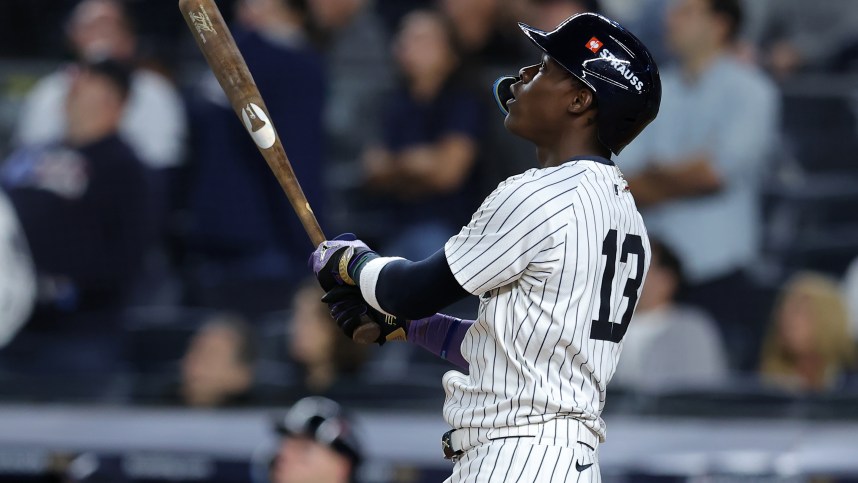 Oct 7, 2024; Bronx, New York, USA; New York Yankees third base Jazz Chisholm Jr. (13) hits a solo home run against the Kansas City Royals in the ninth inning during game two of the ALDS for the 2024 MLB Playoffs at Yankee Stadium. Mandatory Credit: Brad Penner-Imagn Images