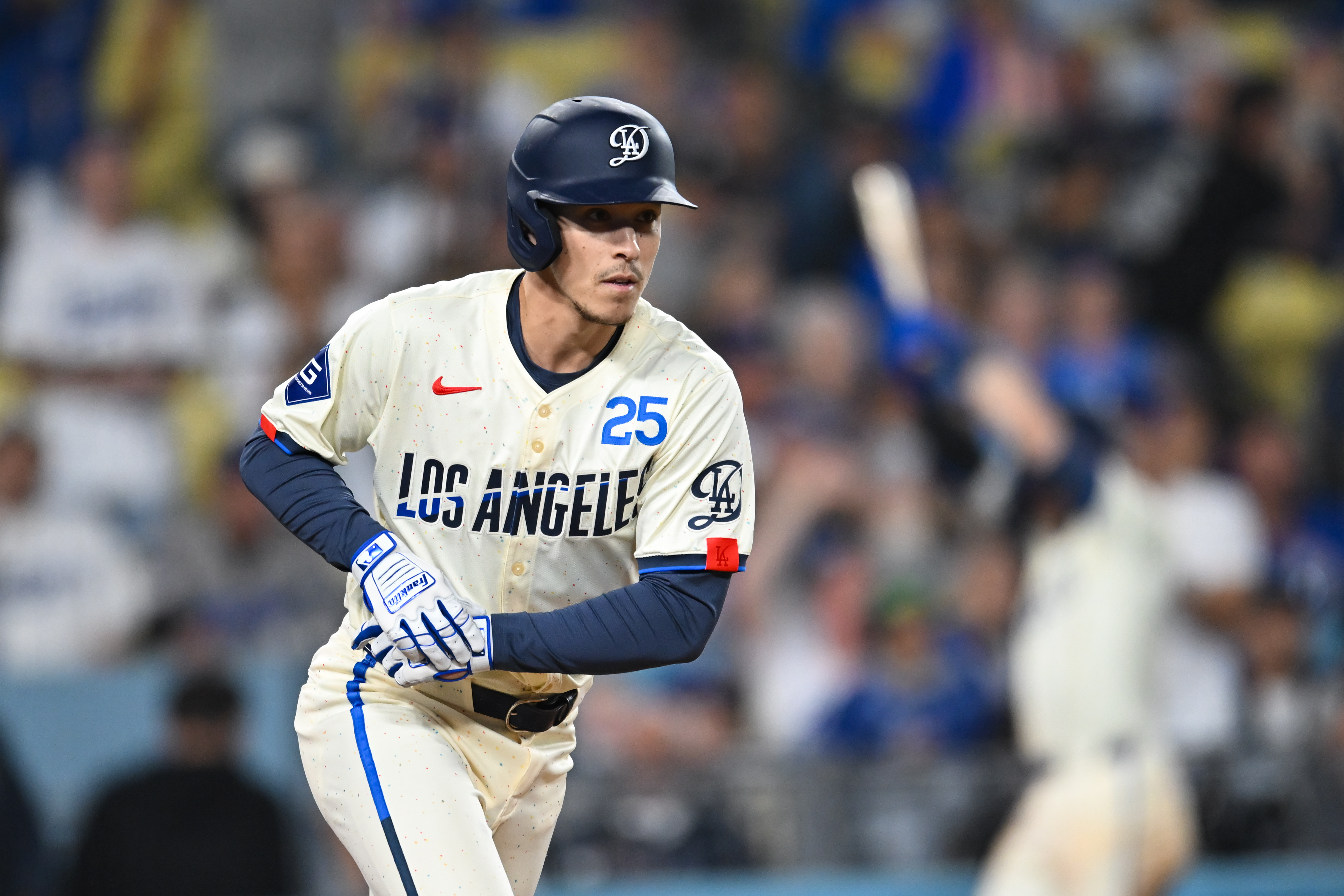 Sep 21, 2024; Los Angeles, California, USA; Los Angeles Dodgers outfielder Tommy Edman (25) walks against the Colorado Rockies during the ninth inning at Dodger Stadium. Mandatory Credit: Jonathan Hui-Imagn Images