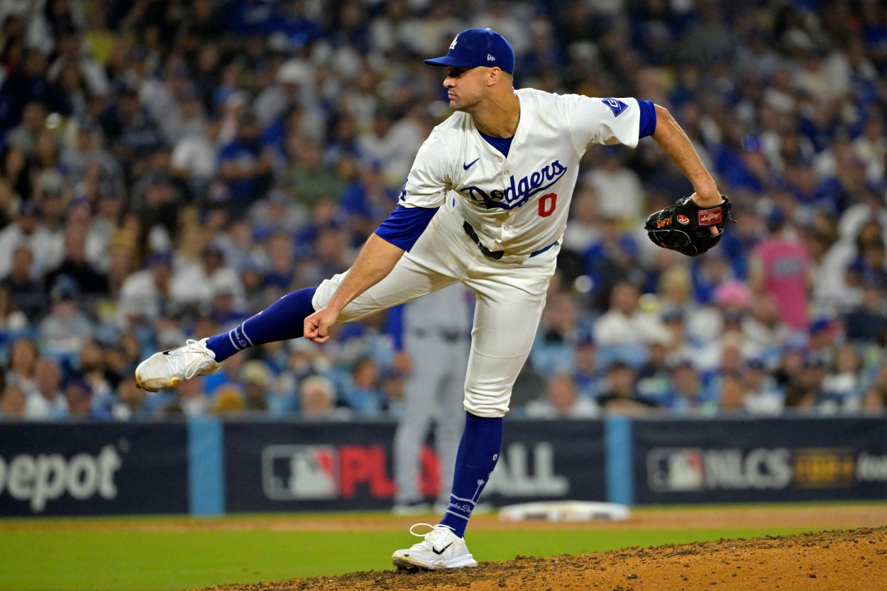 Oct 13, 2024; Los Angeles, California, USA; Los Angeles Dodgers pitcher Jack Flaherty (0) throws a pitch against the New York Mets in the seventh inning during game one of the NLCS for the 2024 MLB Playoffs at Dodger Stadium. Mandatory Credit: Jayne Kamin-Oncea-Imagn Images