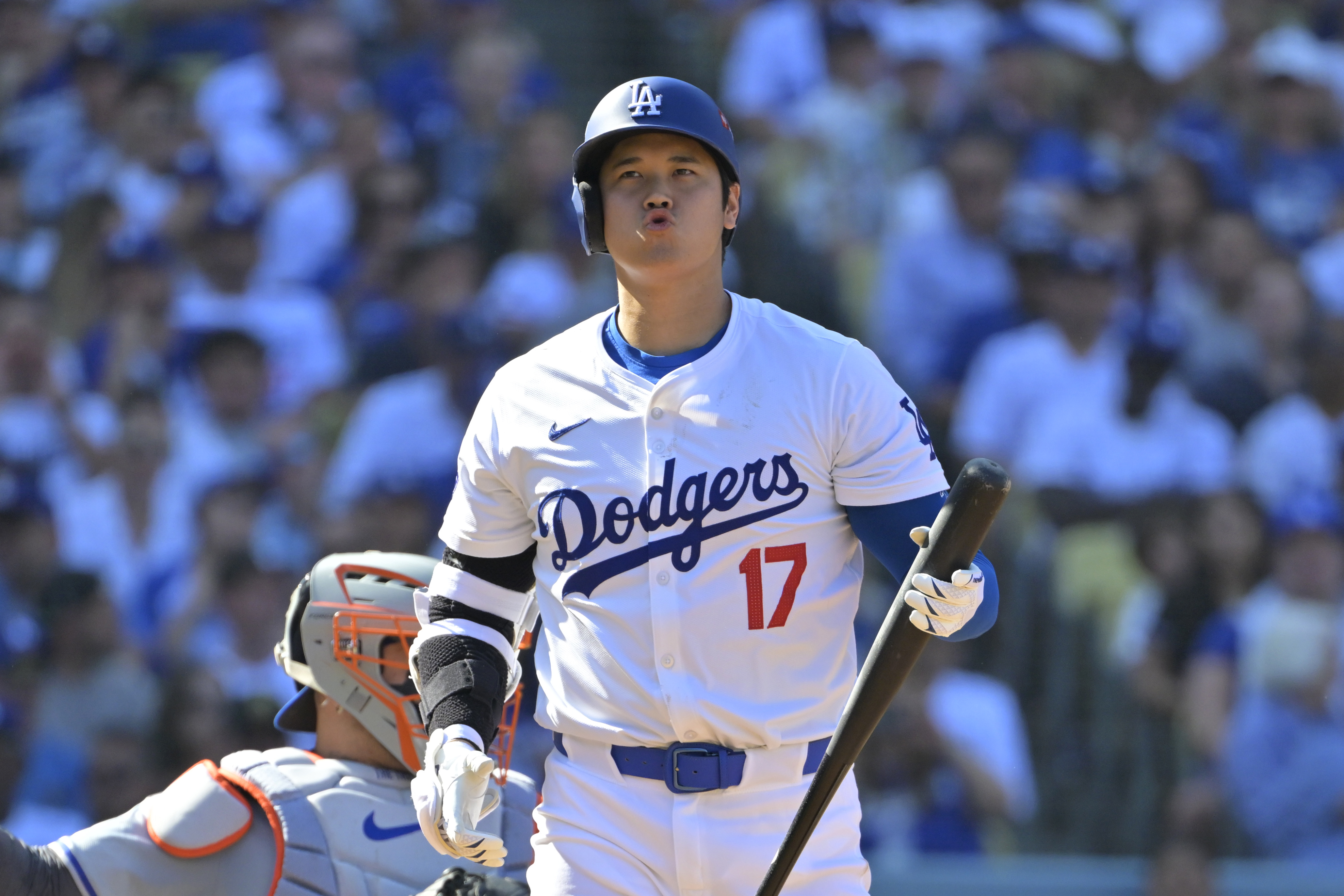 Oct 14, 2024; Los Angeles, California, USA; Los Angeles Dodgers designated hitter Shohei Ohtani (17) reacts after flying out against the New York Mets in the fifth inning during game two of the NLCS for the 2024 MLB Playoffs at Dodger Stadium. Mandatory Credit: Jayne Kamin-Oncea-Imagn Images