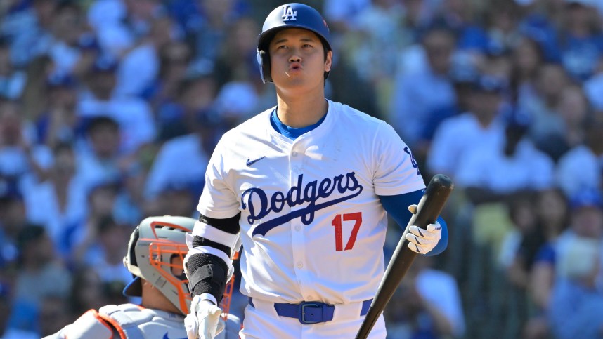 Oct 14, 2024; Los Angeles, California, USA; Los Angeles Dodgers designated hitter Shohei Ohtani (17) reacts after flying out against the New York Mets in the fifth inning during game two of the NLCS for the 2024 MLB Playoffs at Dodger Stadium. Mandatory Credit: Jayne Kamin-Oncea-Imagn Images