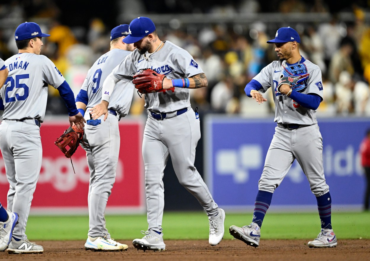 Oct 9, 2024; San Diego, California, USA; Los Angeles Dodgers outfielder Andy Pages (44) and shortstop Mookie Betts (50) celebrate with teammates after winning game four of the NLDS for the 2024 MLB Playoffs against the San Diego Padres at Petco Park.  Mandatory Credit: Denis Poroy-Imagn Images