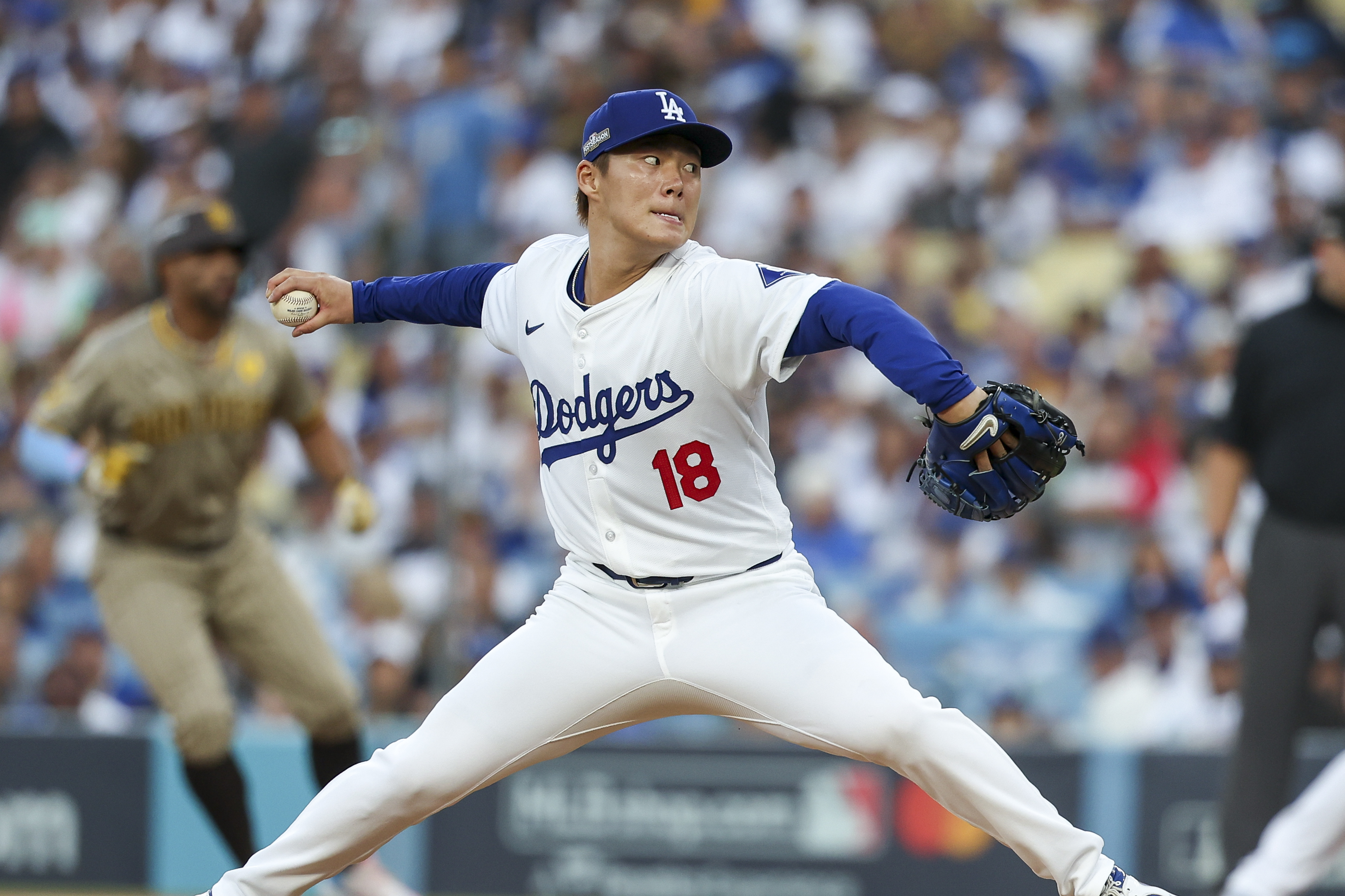 Oct 5, 2024; Los Angeles, California, USA; Los Angeles pitcher Yoshinobu Yamamoto (18) throws a pitch in the first inning against the San Diego Padres during game one of the NLDS for the 2024 MLB Playoffs at Dodger Stadium. Mandatory Credit: Kiyoshi Mio-Imagn Images