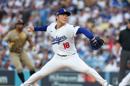 Oct 5, 2024; Los Angeles, California, USA; Los Angeles pitcher Yoshinobu Yamamoto (18) throws a pitch in the first inning against the San Diego Padres during game one of the NLDS for the 2024 MLB Playoffs at Dodger Stadium. Mandatory Credit: Kiyoshi Mio-Imagn Images