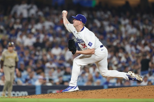 Oct 5, 2024; Los Angeles, California, USA; Los Angeles pitcher Evan Phillips (59) throws a pitch in the sixth inning against the San Diego Padres during game one of the NLDS for the 2024 MLB Playoffs at Dodger Stadium. Mandatory Credit: Kiyoshi Mio-Imagn Images