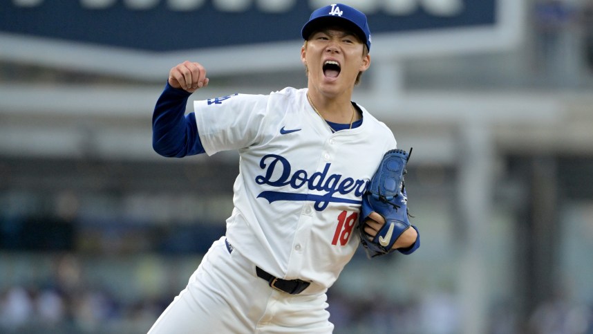 Oct 11, 2024; Los Angeles, California, USA; Los Angeles Dodgers pitcher Yoshinobu Yamamoto (18) reacts in the second inning against the San Diego Padres during game five of the NLDS for the 2024 MLB Playoffs at Dodger Stadium. Mandatory Credit: Jayne Kamin-Oncea-Imagn Images