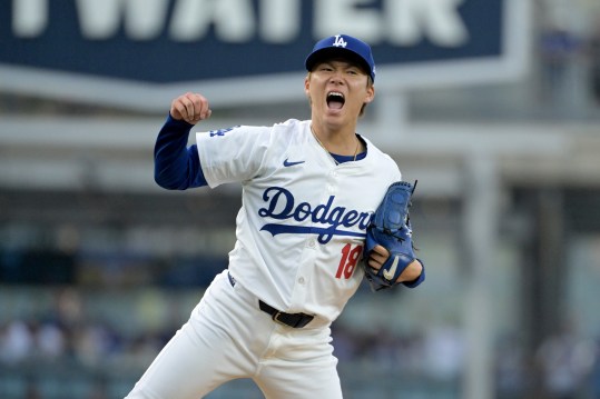 Oct 11, 2024; Los Angeles, California, USA; Los Angeles Dodgers pitcher Yoshinobu Yamamoto (18) reacts in the second inning against the San Diego Padres during game five of the NLDS for the 2024 MLB Playoffs at Dodger Stadium. Mandatory Credit: Jayne Kamin-Oncea-Imagn Images