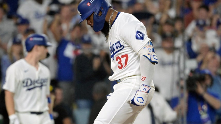 Oct 11, 2024; Los Angeles, California, USA; Los Angeles Dodgers outfielder Teoscar Hernandez (37) celebrates after hitting a solo home run in the seventh inning against the San Diego Padres during game five of the NLDS for the 2024 MLB Playoffs at Dodger Stadium. Mandatory Credit: Jayne Kamin-Oncea-Imagn Images