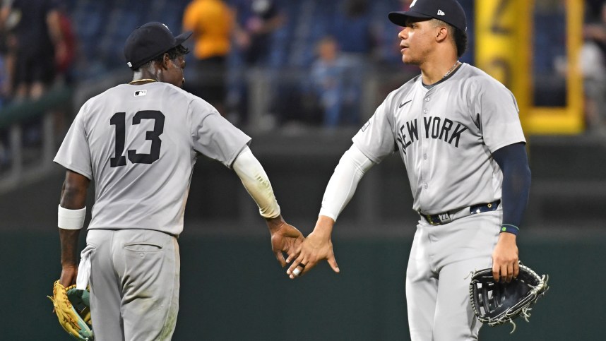 Jul 29, 2024; Philadelphia, Pennsylvania, USA; New York Yankees third baseman Jazz Chisholm, Jr (13) and outfielder Juan Soto (22) celebrate win against the Philadelphia Phillies at Citizens Bank Park. Mandatory Credit: Eric Hartline-Imagn Images