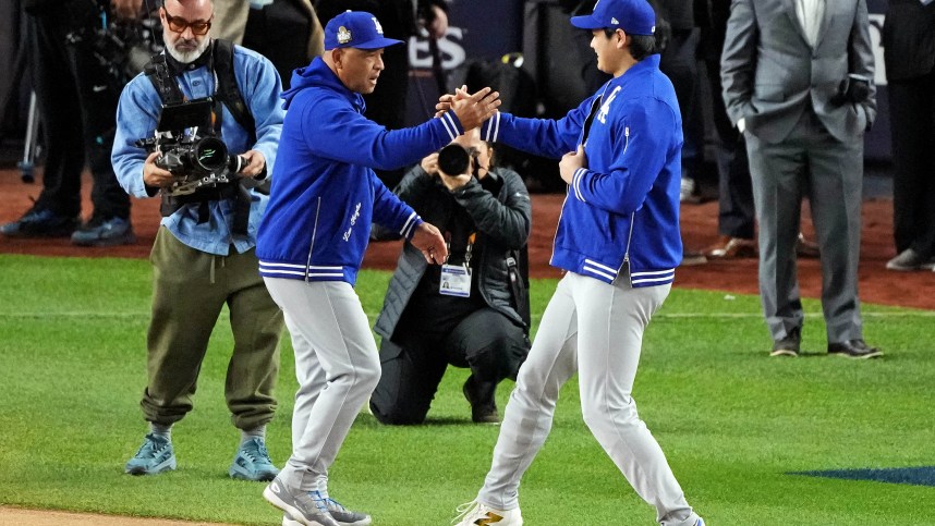 Oct 28, 2024; New York, New York, USA; Los Angeles Dodgers manager Dave Roberts (30) greets two-way player Shohei Ohtani (17) during player introductions before playing against the New York Yankees in game three of the 2024 MLB World Series at Yankee Stadium. Mandatory Credit: Robert Deutsch-Imagn Images