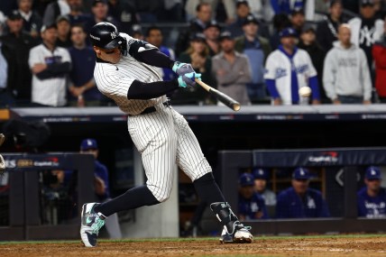 Oct 29, 2024; Bronx, New York, USA; New York Yankees outfielder Aaron Judge (99) hits a single against the Los Angeles Dodgers in the eighth inning during game four of the 2024 MLB World Series at Yankee Stadium. Mandatory Credit: Robert Deutsch-Imagn Images