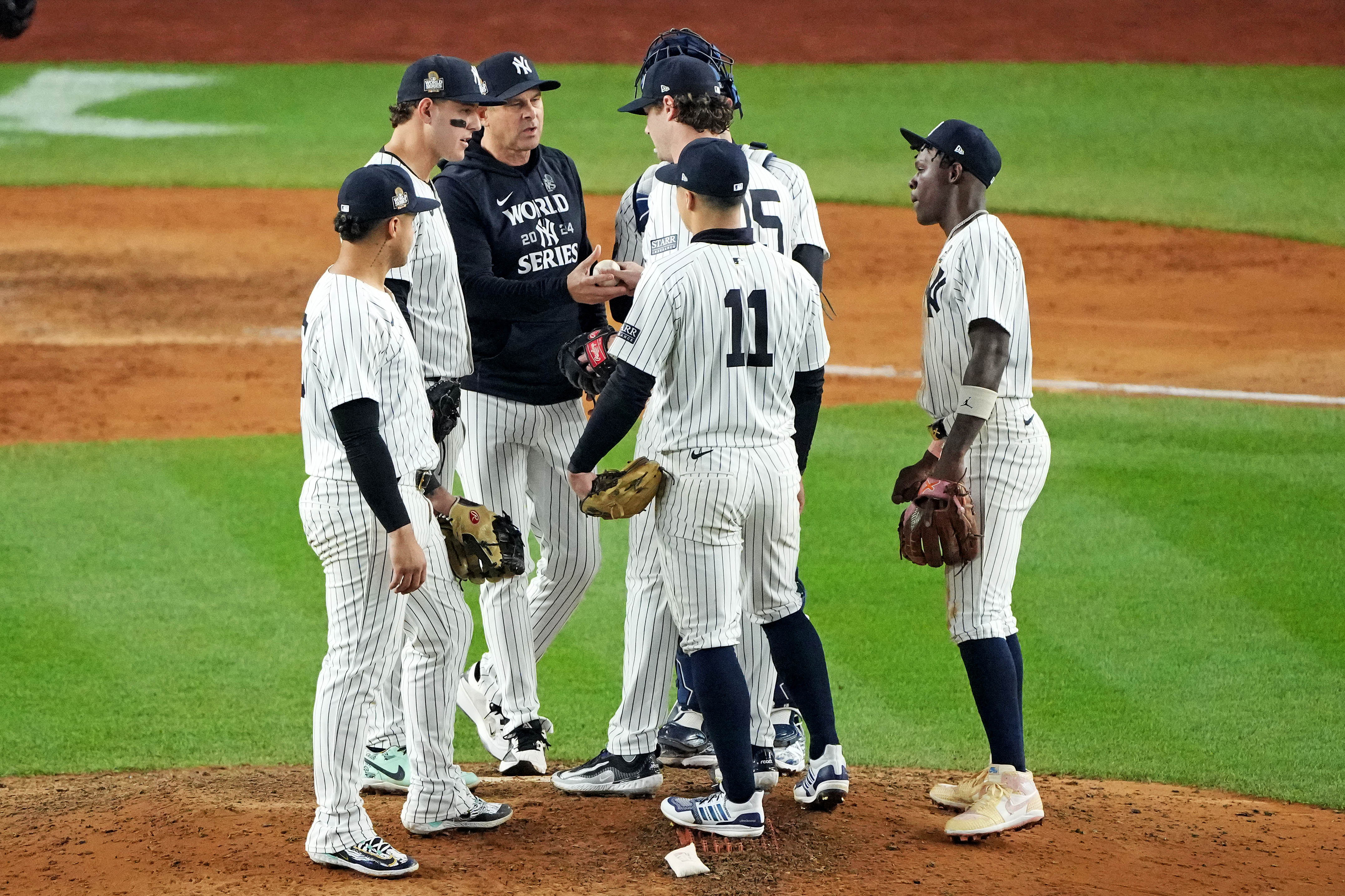 Oct 30, 2024; New York, New York, USA; New York Yankees manager Aaron Boone (17) relieves pitcher Gerrit Cole (45) during the seventh inning against the Los Angeles Dodgers in game four of the 2024 MLB World Series at Yankee Stadium. Mandatory Credit: Robert Deutsch-Imagn Images