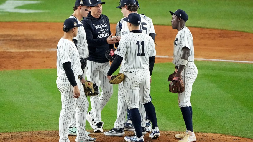 Oct 30, 2024; New York, New York, USA; New York Yankees manager Aaron Boone (17) relieves pitcher Gerrit Cole (45) during the seventh inning against the Los Angeles Dodgers in game four of the 2024 MLB World Series at Yankee Stadium. Mandatory Credit: Robert Deutsch-Imagn Images