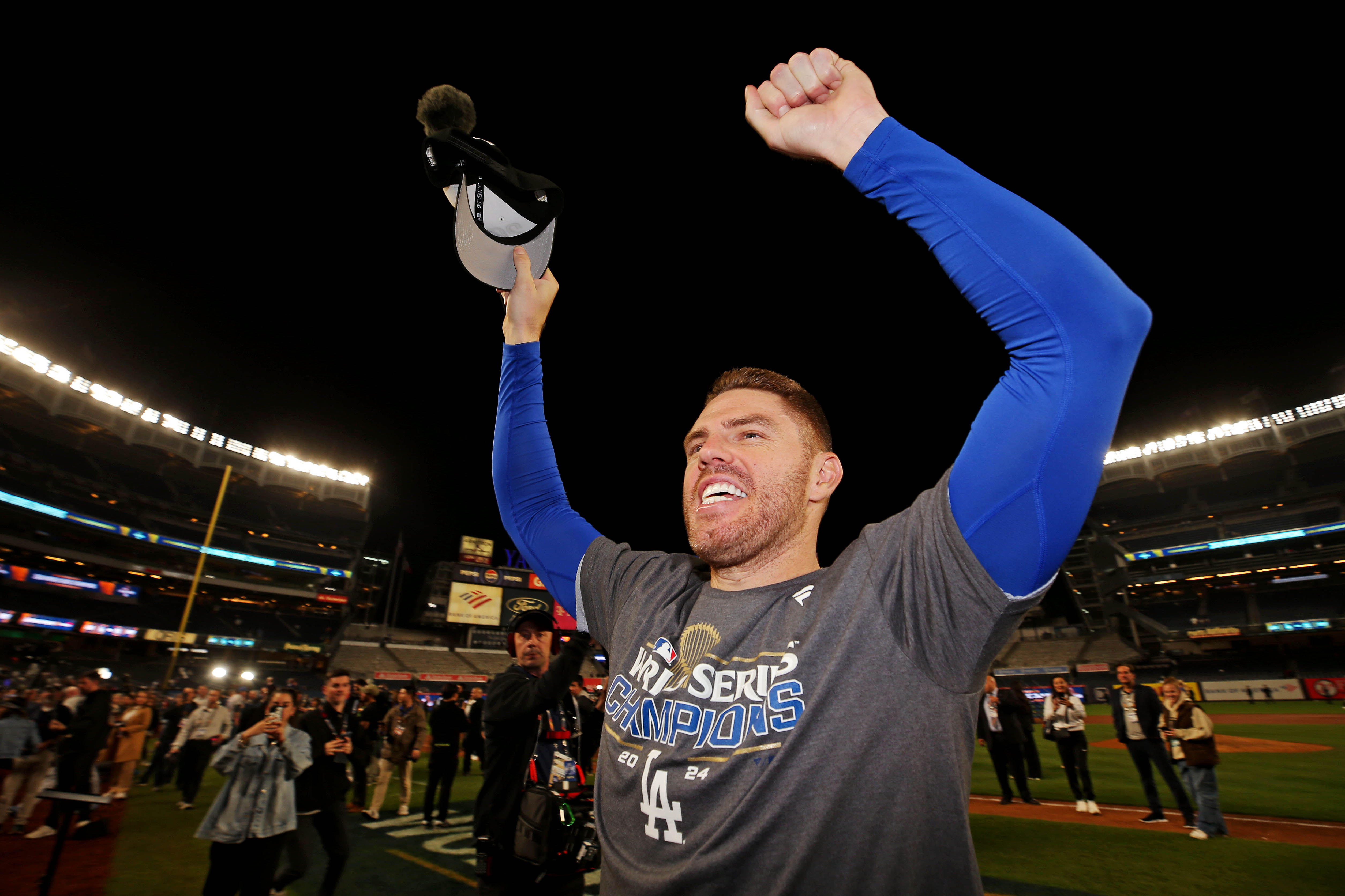 Oct 31, 2024; New York, New York, USA; Los Angeles Dodgers first baseman Freddie Freeman (5) celebrates after the Los Angeles Dodgers beat the New York Yankees in game four to win the 2024 MLB World Series at Yankee Stadium. Mandatory Credit: Brad Penner-Imagn Images