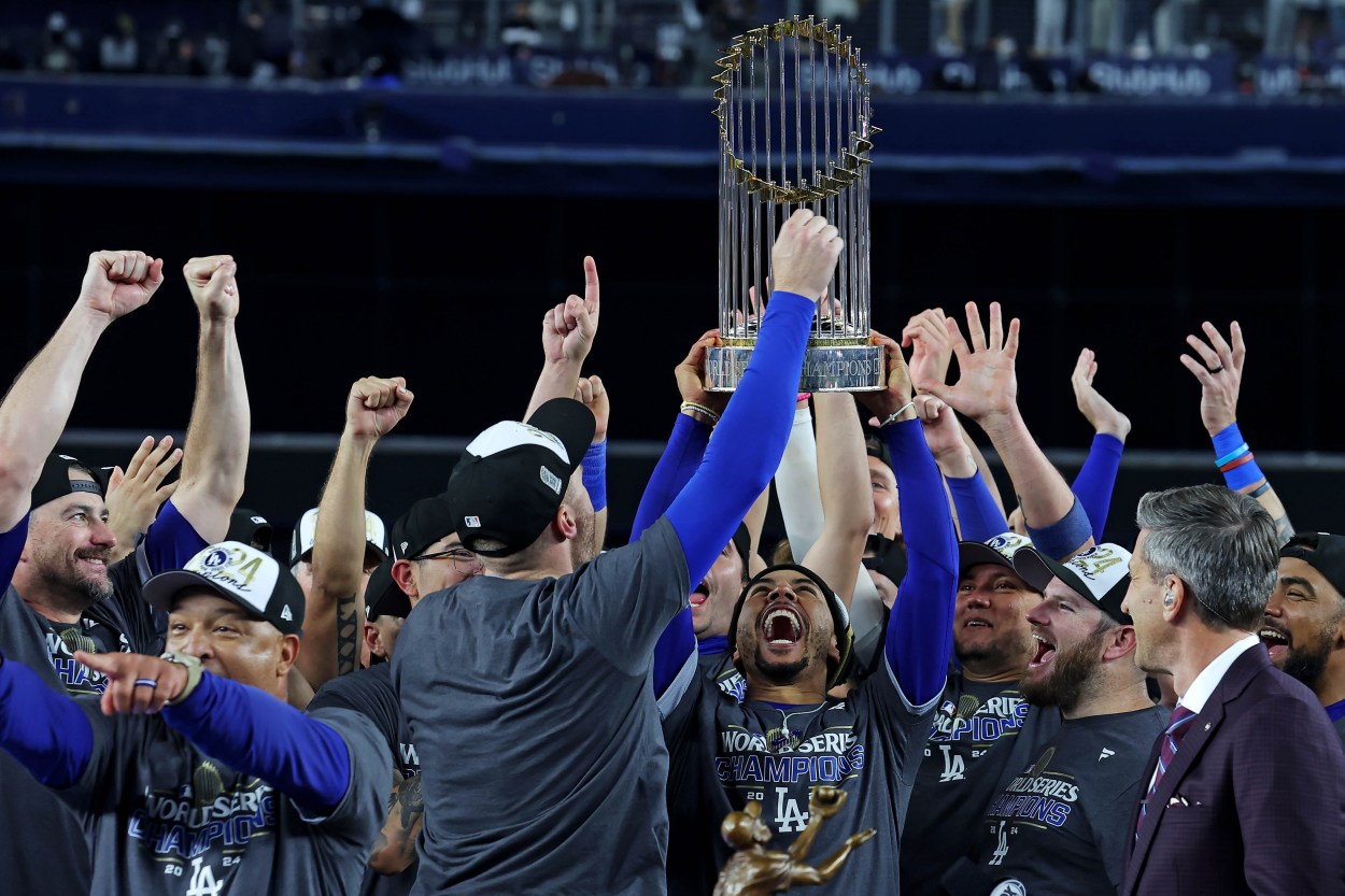 Oct 31, 2024; New York, New York, USA; Los Angeles Dodgers first baseman Freddie Freeman (5) celebrates with the Commissioner’s Trophy after the Los Angeles Dodgers beat the New York Yankees in game four to win the 2024 MLB World Series at Yankee Stadium. Mandatory Credit: Brad Penner-Imagn Images