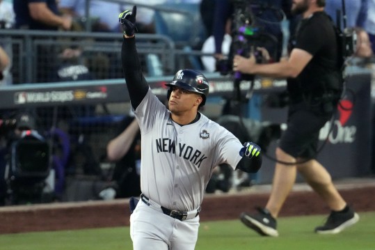 October 26, 2024; Los Angeles, California, United States; New York Yankees outfielder Juan Soto (22) reacts after hitting a home run against the Los Angeles Dodgers in the third inning of game two of the 2024 MLB World Series at Dodger Stadium. Mandatory Credit: Kirby Lee-Imagn Images