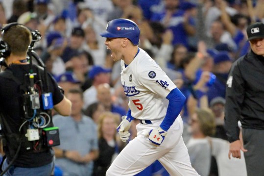 Oct 26, 2024; Los Angeles, California, USA; Los Angeles Dodgers first baseman Freddie Freeman (5) reacts after hitting a solo home run in the third inning against the New York Yankees during game two of the 2024 MLB World Series at Dodger Stadium. Mandatory Credit: Jayne Kamin-Oncea-Imagn Images