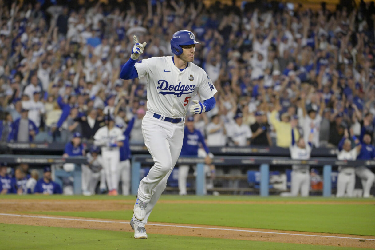 Oct 26, 2024; Los Angeles, California, USA; Los Angeles Dodgers first baseman Freddie Freeman (5) reacts after hitting a solo home run in the third inning against the New York Yankees during game two of the 2024 MLB World Series at Dodger Stadium. Mandatory Credit: Jayne Kamin-Oncea-Imagn Images