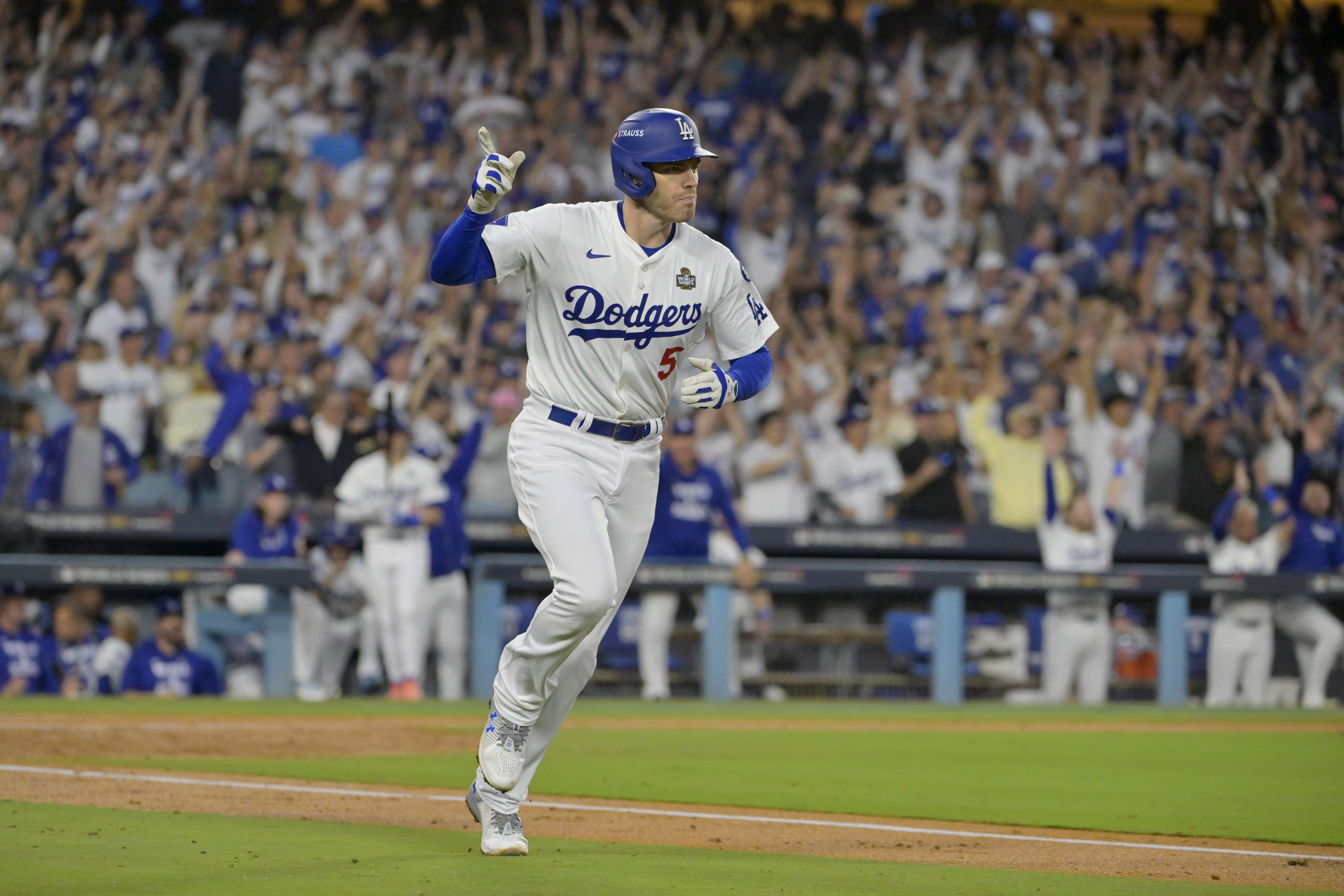 Oct 26, 2024; Los Angeles, California, USA; Los Angeles Dodgers first baseman Freddie Freeman (5) reacts after hitting a solo home run in the third inning against the New York Yankees during game two of the 2024 MLB World Series at Dodger Stadium. Mandatory Credit: Jayne Kamin-Oncea-Imagn Images