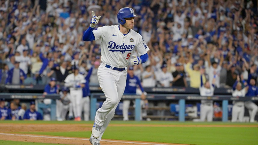 October 26, 2024; Los Angeles, California, United States; Los Angeles Dodgers first baseman Freddie Freeman (5) reacts after hitting a solo home run in the third inning against the New York Yankees during game two of the 2024 MLB World Series at Dodger Stadium. Mandatory Credit: Jayne Kamin-Oncea-Imagn Images