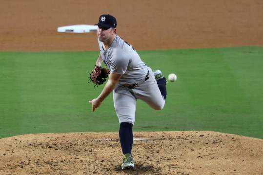 Oct 26, 2024; Los Angeles, California, USA; New York Yankees pitcher Carlos Rodon (55) throws a pitch against the Los Angeles Dodgers in the fourth inning for game two of the 2024 MLB World Series at Dodger Stadium. Mandatory Credit: Kiyoshi Mio-Imagn Images