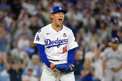 Oct 26, 2024; Los Angeles, California, USA; Los Angeles Dodgers pitcher Yoshinobu Yamamoto (18) reacts in the sixth inning against the New York Yankees during game two of the 2024 MLB World Series at Dodger Stadium. Mandatory Credit: Jayne Kamin-Oncea-Imagn Images