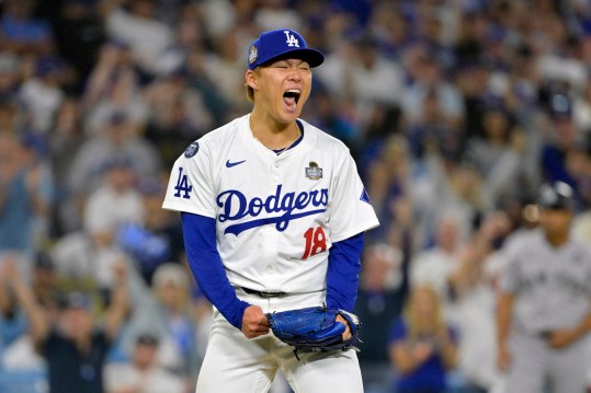 Oct 26, 2024; Los Angeles, California, USA; Los Angeles Dodgers pitcher Yoshinobu Yamamoto (18) reacts in the sixth inning against the New York Yankees during game two of the 2024 MLB World Series at Dodger Stadium. Mandatory Credit: Jayne Kamin-Oncea-Imagn Images