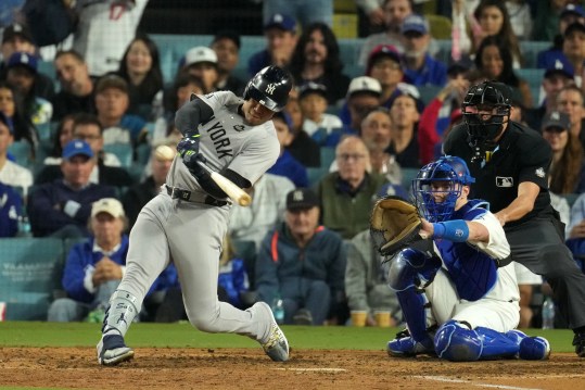 Oct 26, 2024; Los Angeles, California, USA; New York Yankees outfielder Juan Soto (22) hits a single against the Los Angeles Dodgers in the ninth inning for game two of the 2024 MLB World Series at Dodger Stadium. Mandatory Credit: Kirby Lee-Imagn Images