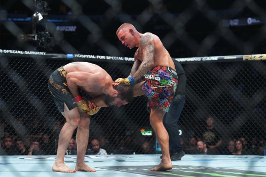 Jun 1, 2024; Newark, New Jersey, USA; Islam Makhachev (red gloves) fights Dustin Poirier (blue gloves) during UFC 302 at Prudential Center. Mandatory Credit: Joe Camporeale-Imagn Images