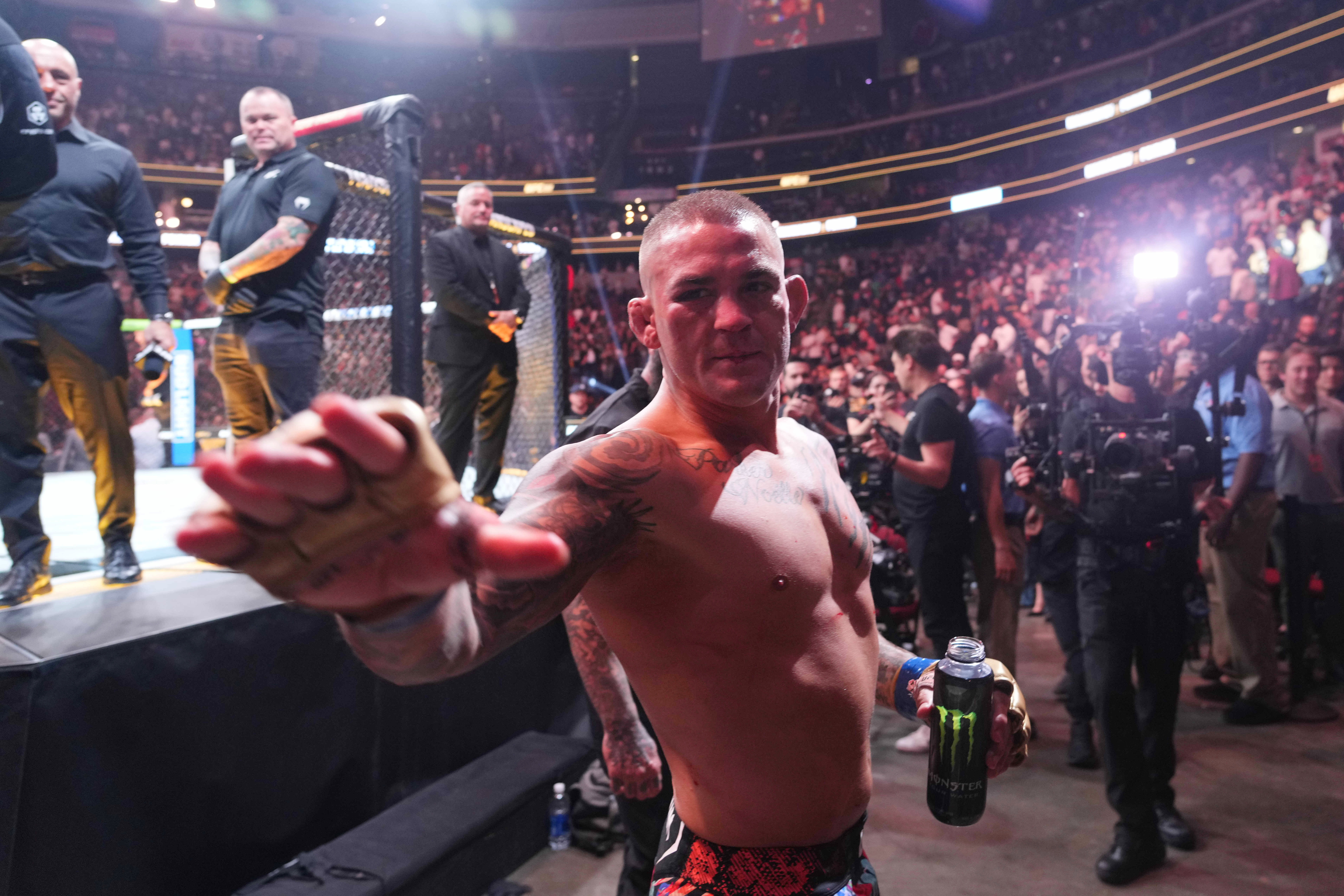 Jun 1, 2024; Newark, New Jersey, USA; Dustin Poirier (blue gloves) after the fight against Islam Makhachev (red gloves) during UFC 302 at Prudential Center. Mandatory Credit: Joe Camporeale-Imagn Images