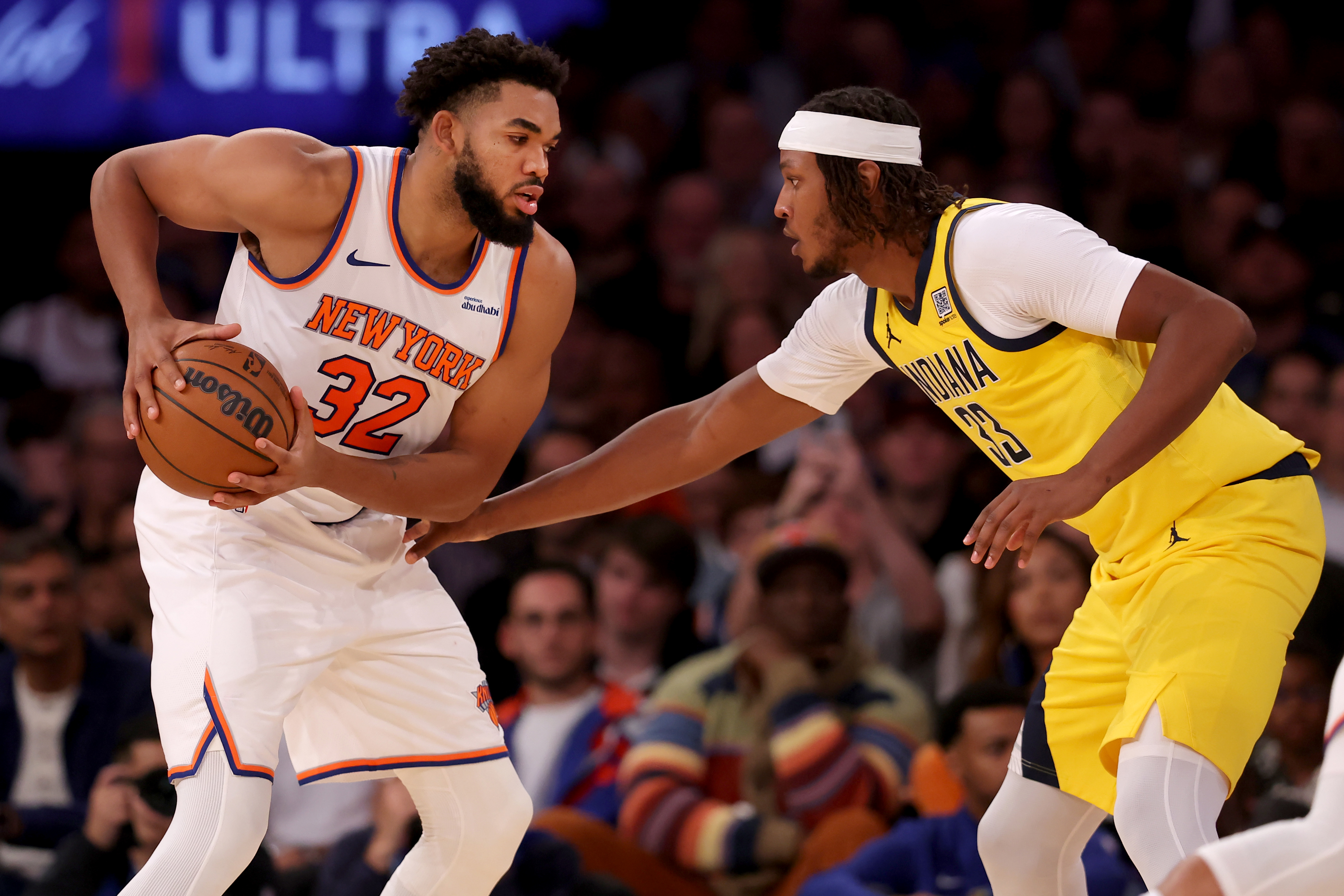 Oct 25, 2024; New York, New York, USA; New York Knicks center Karl-Anthony Towns (32) controls the ball against Indiana Pacers center Myles Turner (33) during the second quarter at Madison Square Garden. Mandatory Credit: Brad Penner-Imagn Images