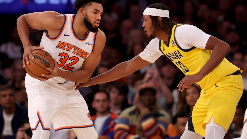 Oct 25, 2024; New York, New York, USA; New York Knicks center Karl-Anthony Towns (32) controls the ball against Indiana Pacers center Myles Turner (33) during the second quarter at Madison Square Garden. Mandatory Credit: Brad Penner-Imagn Images