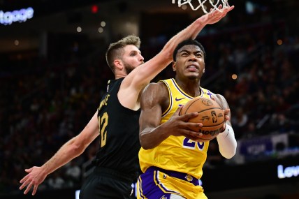 Oct 30, 2024; Cleveland, Ohio, USA; Los Angeles Lakers forward Rui Hachimura (28) drives to the basket against Cleveland Cavaliers forward Dean Wade (32) during the second half at Rocket Mortgage FieldHouse. Mandatory Credit: Ken Blaze-Imagn Images