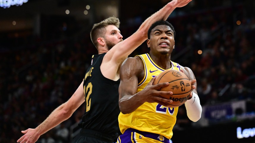 Oct 30, 2024; Cleveland, Ohio, USA; Los Angeles Lakers forward Rui Hachimura (28) drives to the basket against Cleveland Cavaliers forward Dean Wade (32) during the second half at Rocket Mortgage FieldHouse. Mandatory Credit: Ken Blaze-Imagn Images