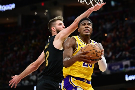 Oct 30, 2024; Cleveland, Ohio, USA; Los Angeles Lakers forward Rui Hachimura (28) drives to the basket against Cleveland Cavaliers forward Dean Wade (32) during the second half at Rocket Mortgage FieldHouse. Mandatory Credit: Ken Blaze-Imagn Images