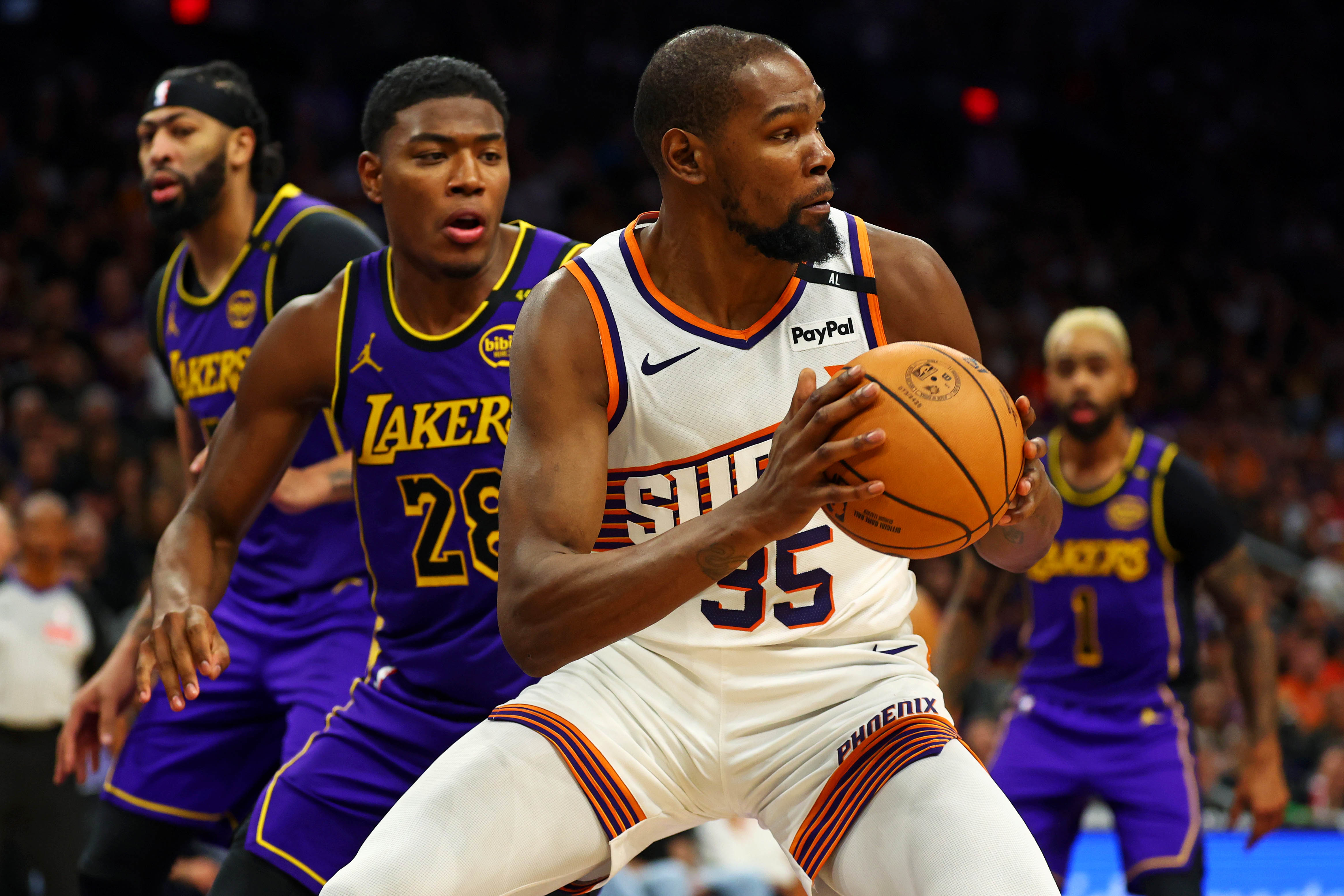 Oct 28, 2024; Phoenix, Arizona, USA; Phoenix Suns forward Kevin Durant (35) handles the ball against Los Angeles Lakers forward Rui Hachimura (28) during the second half at Footprint Center. Mandatory Credit: Mark J. Rebilas-Imagn Images