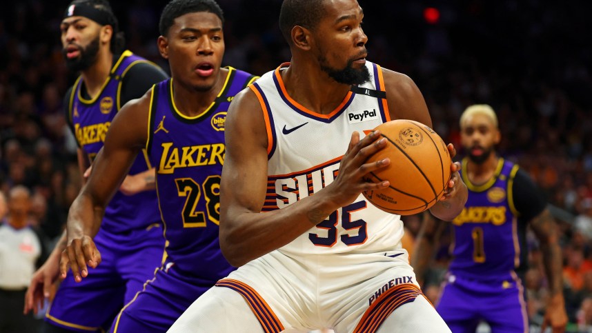 Oct 28, 2024; Phoenix, Arizona, USA; Phoenix Suns forward Kevin Durant (35) handles the ball against Los Angeles Lakers forward Rui Hachimura (28) during the second half at Footprint Center. Mandatory Credit: Mark J. Rebilas-Imagn Images