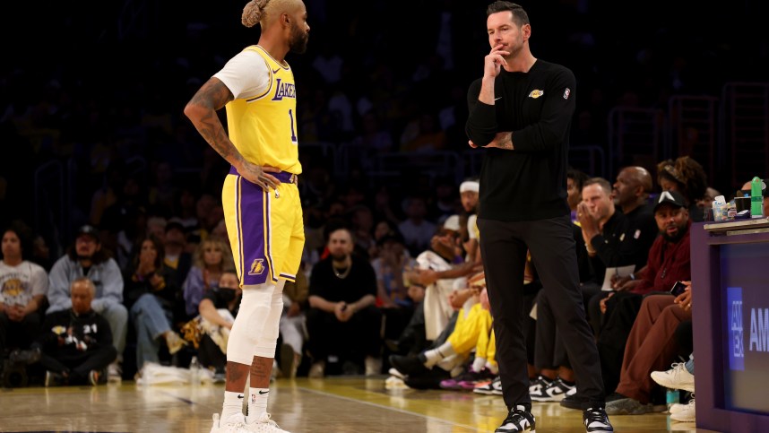 Oct 22, 2024; Los Angeles, California, USA; Los Angeles Lakers guard D'Angelo Russell (1) talks with head coach JJ Redick during the first quarter against the Minnesota Timberwolves at Crypto.com Arena. Mandatory Credit: Jason Parkhurst-Imagn Images