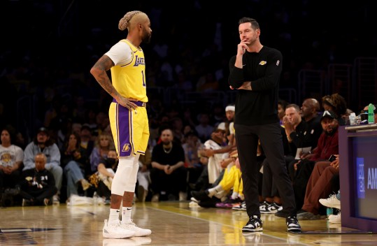 October 22, 2024; Los Angeles, California, USA; Los Angeles Lakers guard D'Angelo Russell (1) talks with head coach JJ Redick during the first quarter against the Minnesota Timberwolves at Crypto.com Arena. Mandatory credits: Jason Parkhurst-Imagn Images