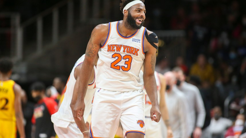 Jan 15, 2022; Atlanta, Georgia, USA; New York Knicks center Mitchell Robinson (23) celebrates after a dunk against the Atlanta Hawks in the second half at State Farm Arena. Mandatory Credit: Brett Davis-Imagn Images