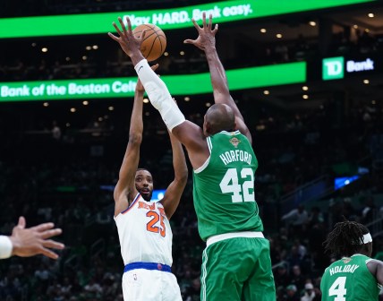 Oct 22, 2024; Boston, Massachusetts, USA; New York Knicks forward Mikal Bridges (25) shoots against Boston Celtics center Al Horford (42) in the second half at TD Garden. Mandatory Credit: David Butler II-Imagn Images